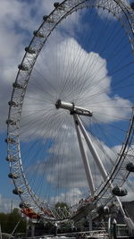 Low angle view of ferris wheel against sky