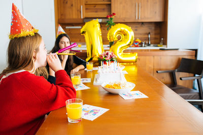 Girls enjoying birthday party at home