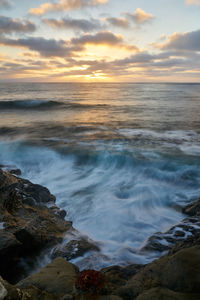 Scenic view of sea against sky during sunset