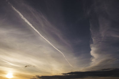 Low angle view of vapor trails in sky