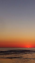 Scenic view of sea against clear sky during sunset