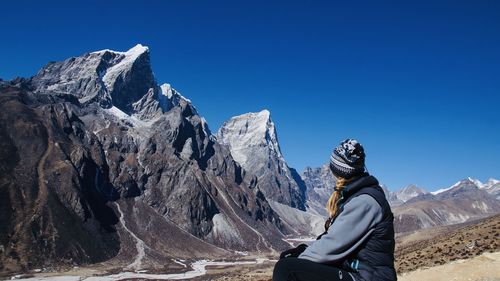 Scenic view of snowcapped mountains against clear sky