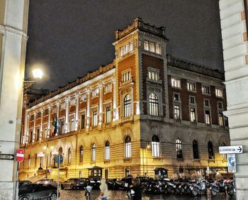 Low angle view of illuminated building at night