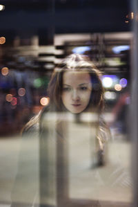 Portrait of young woman on street