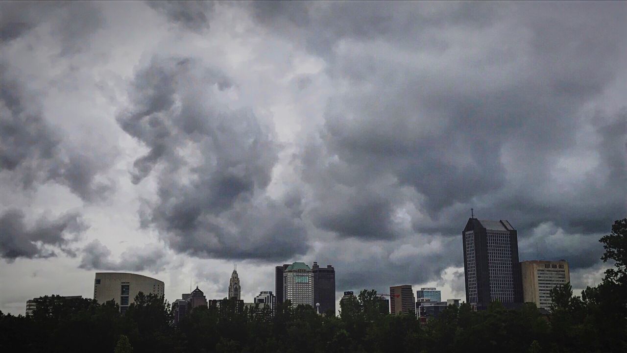 sky, cloud - sky, city, architecture, building exterior, weather, tree, storm cloud, built structure, skyscraper, cityscape, no people, outdoors, nature, day, thunderstorm, growth, beauty in nature, modern, urban skyline