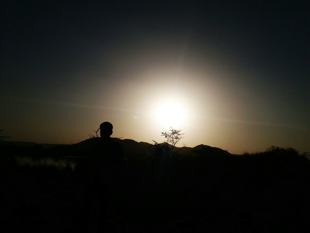 silhouette, nature, sky, beauty in nature, outdoors, scenics, real people, sunset, sun, only men, men, tree, one person, one man only, people, day