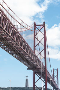 Low angle view of suspension bridge in lisbond portugal