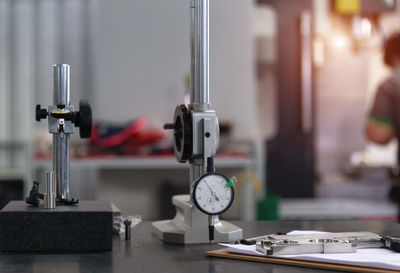 Close-up of electric lamp on table