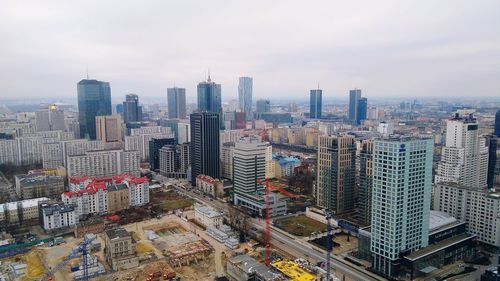 Aerial view of cityscape against sky