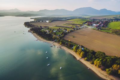 Scenic view of beach by mountains