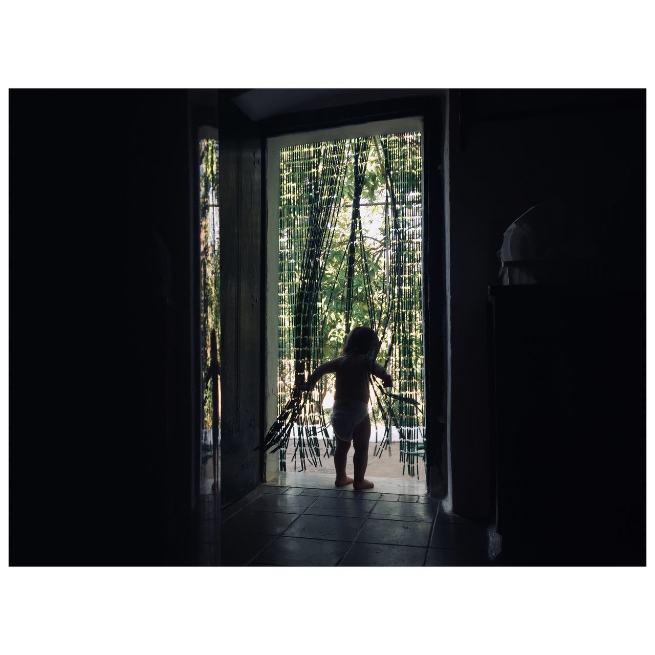 REAR VIEW OF SILHOUETTE MAN STANDING ON BUILDING