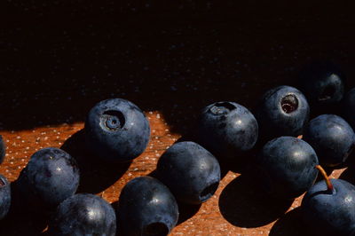 Close-up of blueberries against black background