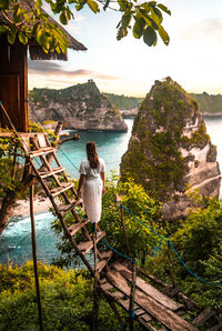 Rear view of woman looking at sea