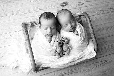 High angle view of cute baby boy sleeping on table