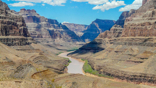 Scenic view of canyon against blue sky