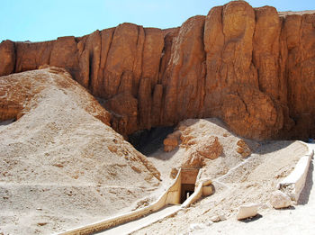 Rock formation on land against sky