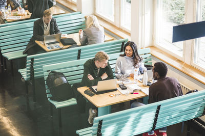 High angle view of people on table