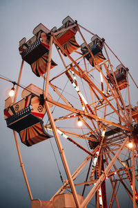 Low angle view of ferris wheel against sky