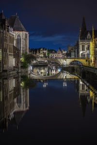 Scenic view of old town and canal with reflections