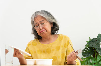 Portrait of woman holding ice cream