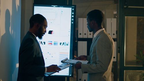 Side view of man working in office