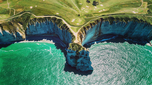 High angle view of rocks by sea