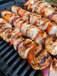 High angle view of meat on barbecue grill