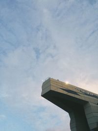 Low angle view of building against cloudy sky