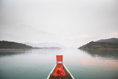 Scenic view of lake with mountains in background