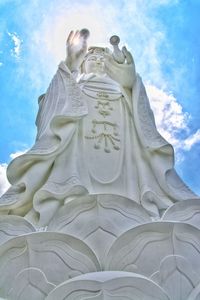 Low angle view of statue against sky