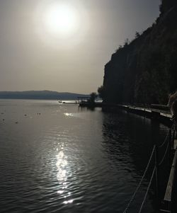 Sun shining over calm lake
