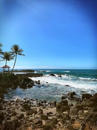 Scenic view of sea against clear blue sky