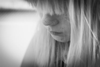 Close-up of a girl with long blond hair