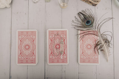 Fortune telling a deck of tarot cards with other fortune telling items blue pastel background.