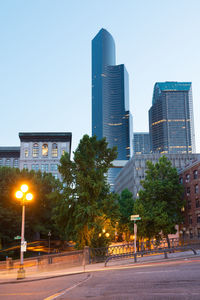 View of city buildings against clear sky