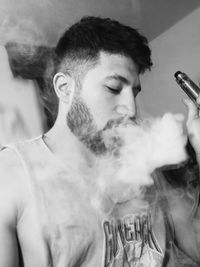 Young man smoking cigarette