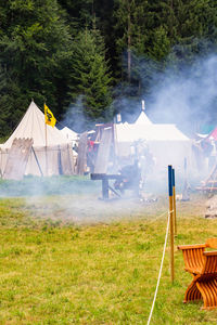 Tent on field against mountain