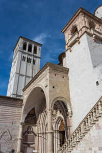 Low angle view of bell tower against sky