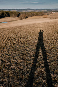 Shadow of person on field