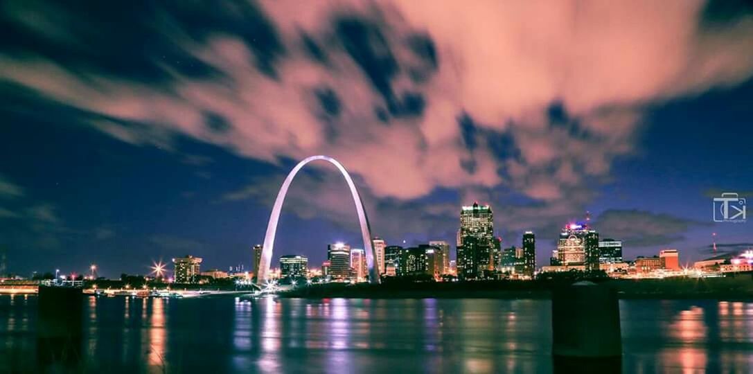 REFLECTION OF ILLUMINATED CITY AT NIGHT