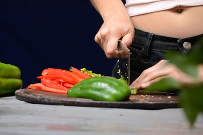 Midsection of person preparing food