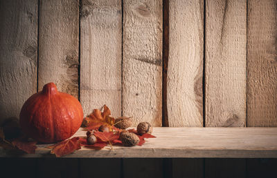 View of pumpkins on table against wall