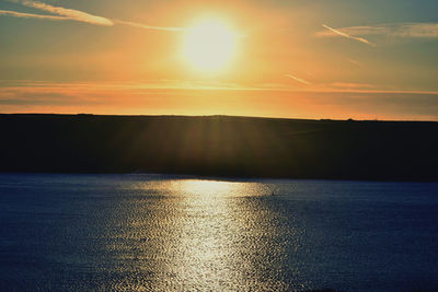 Scenic view of sunset over water