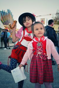 Full length of mother and girl in traditional clothing