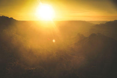 Scenic view of landscape against sky during sunset