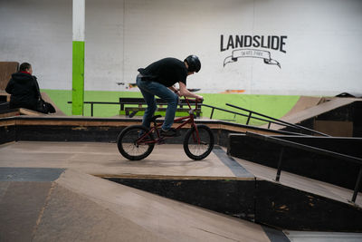 Side view of man cycling on bicycle