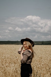 Young woman standing in field