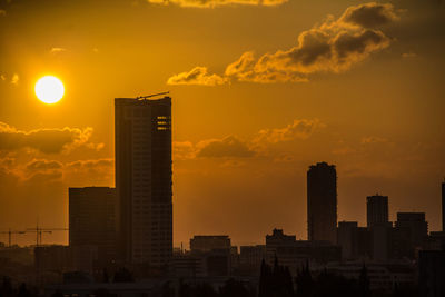 View of skyscrapers at sunset