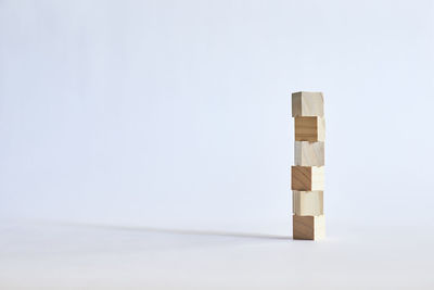 Stack of toy on table against white background