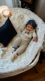 High angle view of cute baby boy sleeping on table